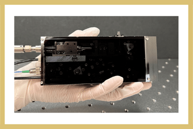 Palm-Sized All-in-One Backward Terahertz-Wave Parametric Oscillator